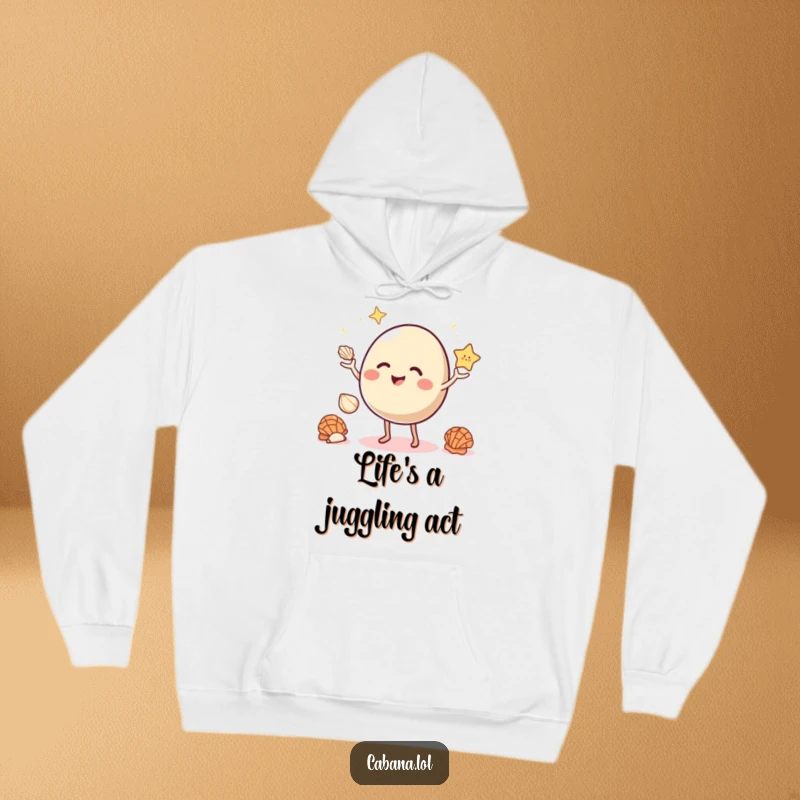 Funny hoodie featuring a giggling, bouncy object with small legs juggling three seashells.